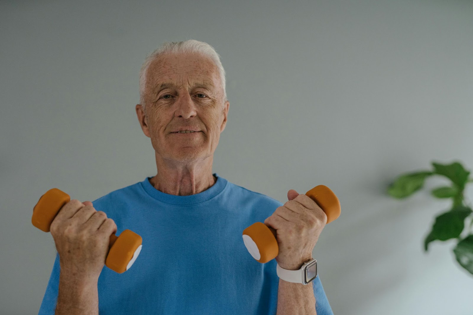 Estrogen Blocker Supplement - a man holding two dumbells